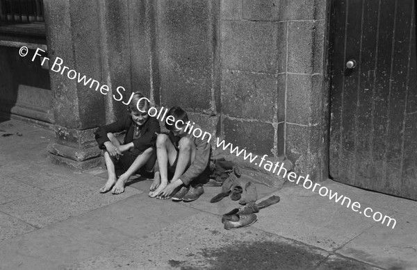 BOYS AT KINGSBRIDGE DRYING FEET